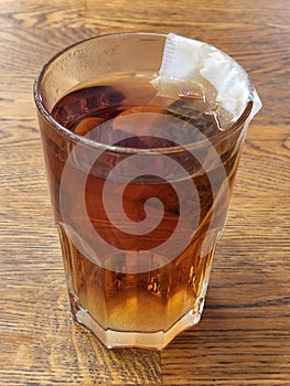 Tea. Black tea brewed in a glass. Hot brewed tea