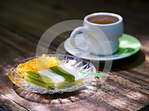 tea break, Thai sweetmeat layer cake traditional wooden background photo