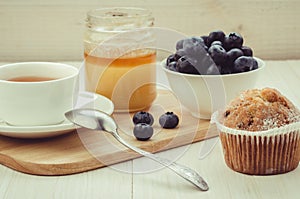 tea with cake, honey and fresh blueberry/healthy breakfast: tea with cake, honey and fresh blueberry