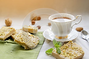 tea, cakes, chocolate pieces, halva on table