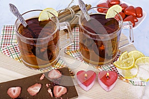 Tea candles in heart-shaped cinnamon sticks.