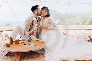 Tea ceremony at a boho wedding. Bride and groom in boho.