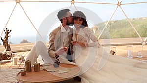 Tea ceremony at a boho wedding. Bride and groom in boho.