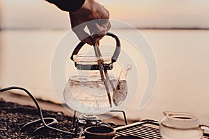 Tea ceremony on the river bank