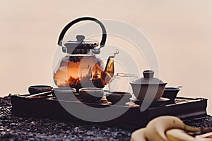 Tea ceremony on the river bank