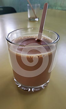 Tea chai on table in a hotel India , Indian masala chai tea or black tea made with various spices and ingredients