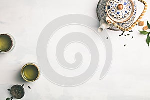 Tea composition on grey background, flat lay