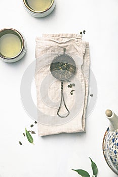 Tea composition on grey background, flat lay