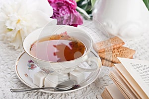 Tea, cookies, the book and peonies