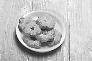 Tea cookies on grey wooden background. Composition of tiny gateau