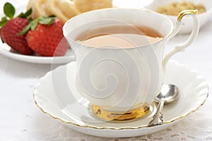 Tea with cruller and strawberries
