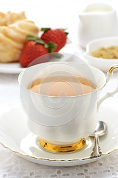 Tea with cruller and strawberries