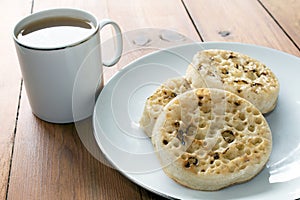 Tea and Crumpets on Wooden Table