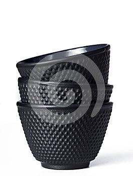 Tea cup of black cast iron