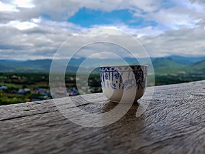 Tea cup ceremony porcellane wood underground outside nature asia tropical drink blue art chiang mai pai thailand hill