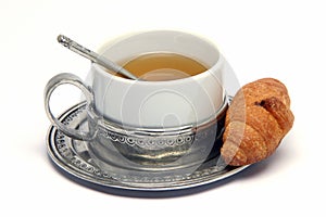 Tea cup and croisant photo