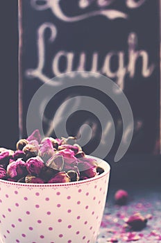 Tea cup with dry roses