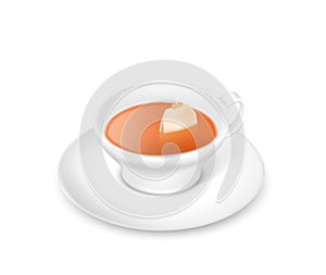 Tea cup with paper teabag and hot brown beverage for breakfast. Porcelain teacup on saucer