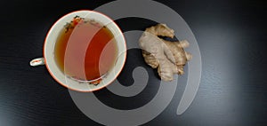 Tea cup porcelein old fashion with ginger black background for the afternoon tea/ tea time!