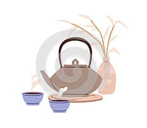 Tea cups, kettle, vase composition. Teakettle, teacups with hot warm drink, traditional morning beverage brewed in