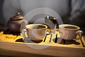 Tea drinking. Evening. Puer. Tea desk. Cups.