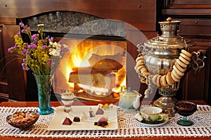 Tea drinking at a fireplace