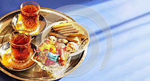 Tea in East Azerbaijan national Cup armud, with sweets on the table