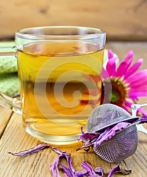 Tea from Echinacea in glass mug with strainer