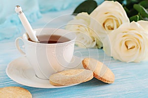 Tea in elegant porcelain cup and shortbread