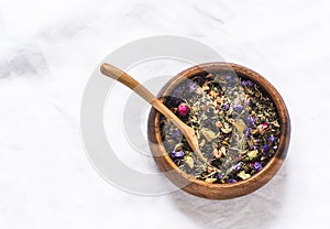 Tea flower herbal collection. Decaf dry tea collection on a light background, top view photo