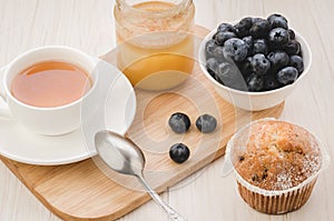 tea with fresh berries, cake and honey/ healthy breakfast: tea with fresh berries, cake and honey. Top view