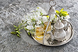 Tea glasses and pot. Oriental holidays decoration. Silver Tableware