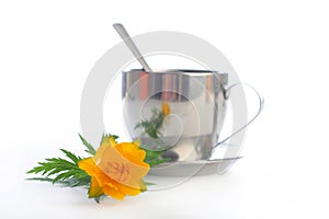 Tea with a globeflower. Isolated