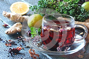 Tea from herbs with ginger, lemon in a rustic style