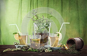Tea with herbs and glasses