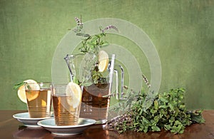 Tea with herbs and glasses