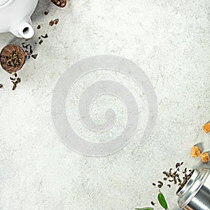 Tea Ingredients and Teapot Flat Lay with Ample Copy Space