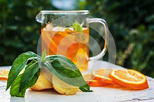 Tea with lemon, ginger and mint in glass cup