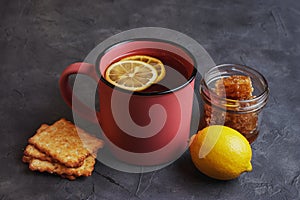 Tea with lemon, honey and grain biscuits. Traditional folk remedy for colds