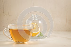 Tea with a lemon and mint in glass cup/tea with a lemon and mint