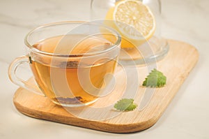 Tea with a lemon and mint in glass/tea with a lemon and mint on