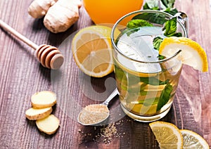 Tea with mint and lemon in a glass cup