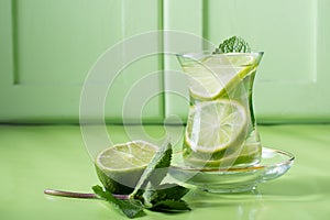 tea with mint and lime, with a calming effect, green still life close-up