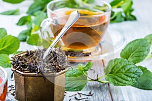 Tea. Mint Tea. Herbal tea. Mint leaf. Mint leaves. Tea in a glass cup, mint leaves, dried tea, sliced lime. herbs tea and mint lea