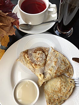 Tea and pancakes with vanilla cream