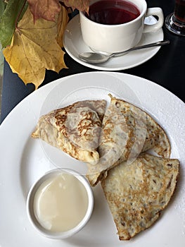 Tea and pancakes with vanilla cream