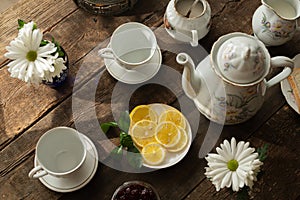 Tea party. Porcelain tea set on wooden table.