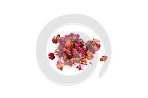 Tea from petals and rosebuds scattered on the table in a bunch