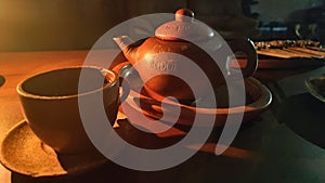 Tea Poci is tea that is brewed in a typical teapot (pot) made of clay and sweetened by adding rock sugar. photo