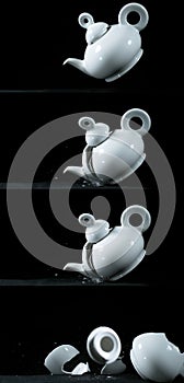 Tea-Pot falling and exploding on Black Background